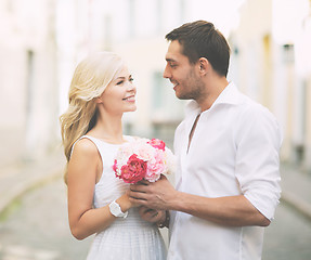 Image showing couple with flowers in the city