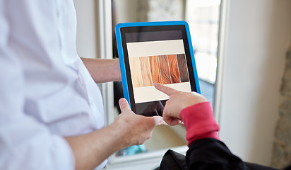 Image showing woman and stylist with tablet pc at beauty salon