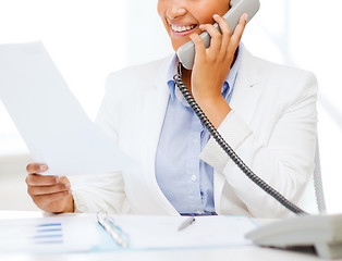 Image showing african businesswoman with phone in office