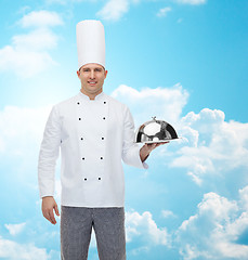 Image showing happy male chef cook holding cloche