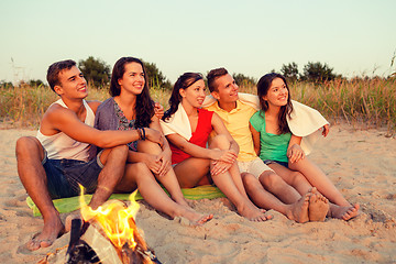 Image showing smiling friends in sunglasses on summer beach