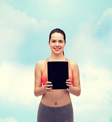 Image showing sporty woman with tablet pc blank screen