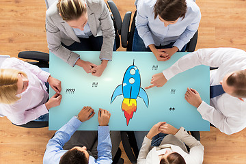 Image showing close up of business team sitting at table