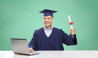 Image showing smiling adult student in mortarboard with diploma