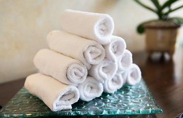 Image showing rolled bath towels at hotel spa