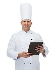 Image showing happy male chef cook holding tablet pc