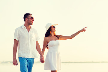 Image showing smiling couple walking outdoors