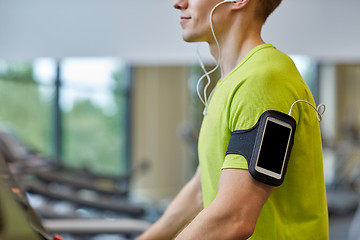 Image showing close up of man exercising on treadmill in gym