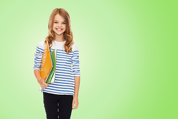 Image showing happy girl holding colorful folders