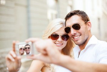 Image showing couple taking photo in cafe