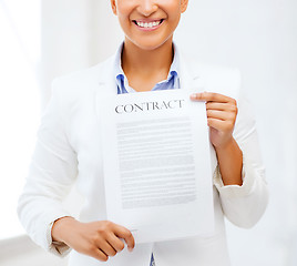 Image showing african businesswoman holding contract