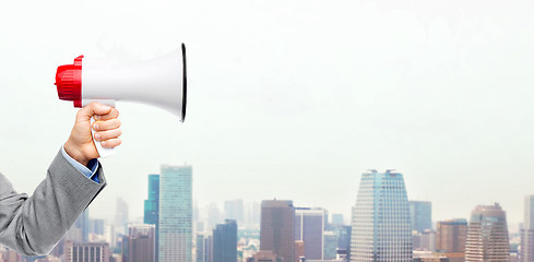 Image showing business man hand holding megaphone