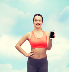 Image showing sporty woman with smartphone