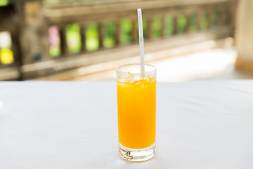 Image showing glass of fresh orange fruit juice at restaurant
