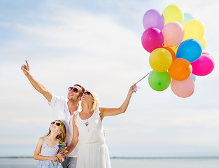 Image showing family with colorful balloons