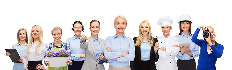 Image showing happy businesswoman over professional workers