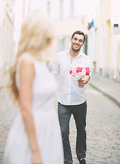 Image showing couple with flowers in the city