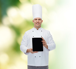 Image showing happy male chef cook showing with tablet pc