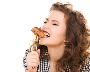 Image showing paleo diet concept - woman eating meat