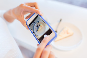 Image showing woman hands with smartphone taking food picture