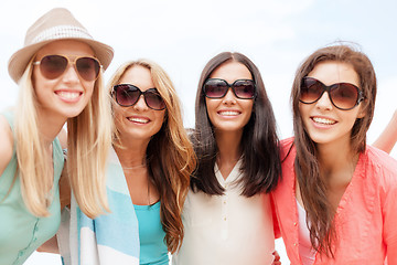 Image showing girls in shades having fun on the beach
