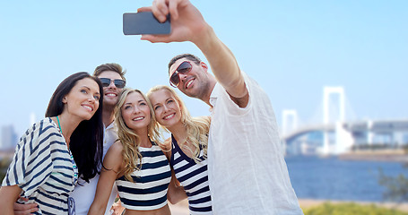 Image showing friends taking selfie with smartphone