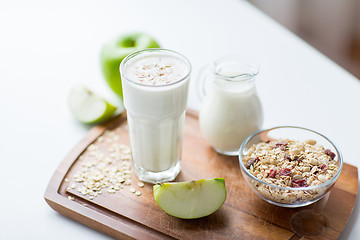 Image showing close up of muesli and yogurt on cutting board