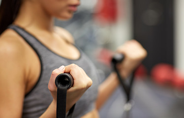 Image showing close up of woman exercising on gym machine