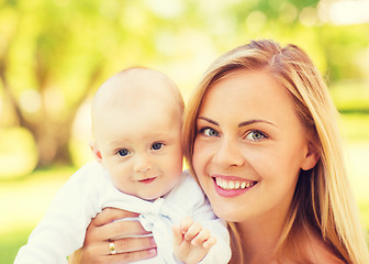 Image showing close up of happy mother with little baby in park