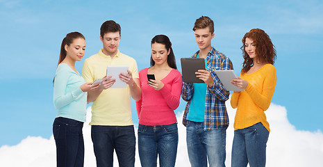 Image showing group of teenagers with smartphones and tablet pc