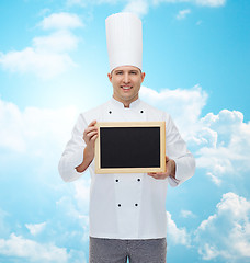 Image showing happy male chef cook holding blank menu board