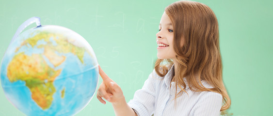 Image showing smiling student girl with globe at school