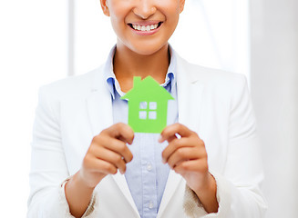 Image showing african woman holding green paper house