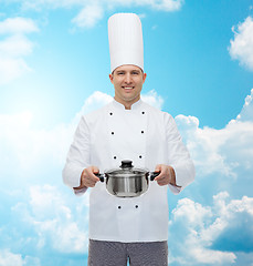 Image showing happy male chef cook holding pot