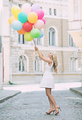 Image showing woman with colorful balloons