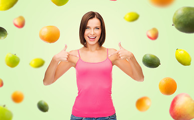 Image showing woman in blank pink tank top pointing fingers