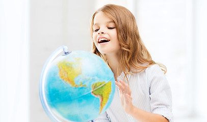 Image showing student girl with globe at school