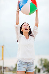 Image showing girl playing ball on the beach