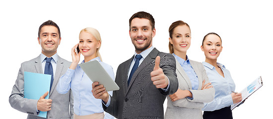 Image showing group of smiling businessmen showing thumbs up