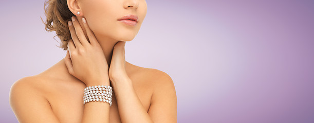 Image showing beautiful woman with pearl earrings and bracelet