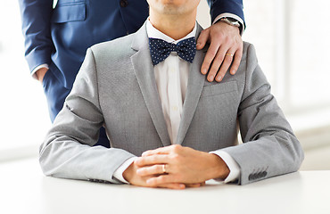 Image showing close up of male gay couple with wedding rings on