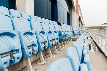 Image showing rows with folded seats of bleachers on stadium