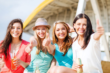 Image showing girls with drinks on the beach