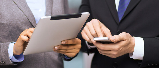 Image showing two businesspeople with smartphone and tablet pc