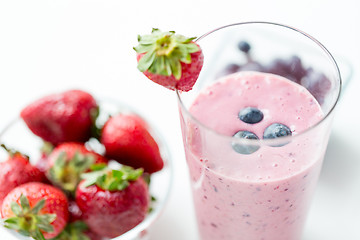 Image showing close up of milkshake decorated with strawberry