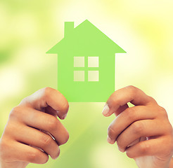 Image showing woman hands holding green house