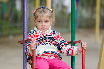 Image showing Offended by the girl on swing does not want to go home