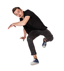 Image showing Break dancer doing one handed handstand against a white background