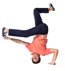 Image showing Break dancer doing one handed handstand against a white background