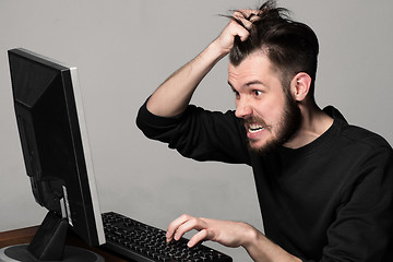 Image showing Funny and crazy man using a computer